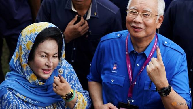 file-photo-malaysia-s-prime-minister-najib-razak-and-his-wife-rosmah-mansor-show-their-ink-stained-fingers-after-voting-in-malaysia-s-general-election-in-pekan-2.jpg