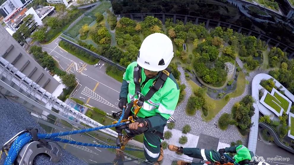To do their job, they dangle from highrise buildings by just a rope CNA