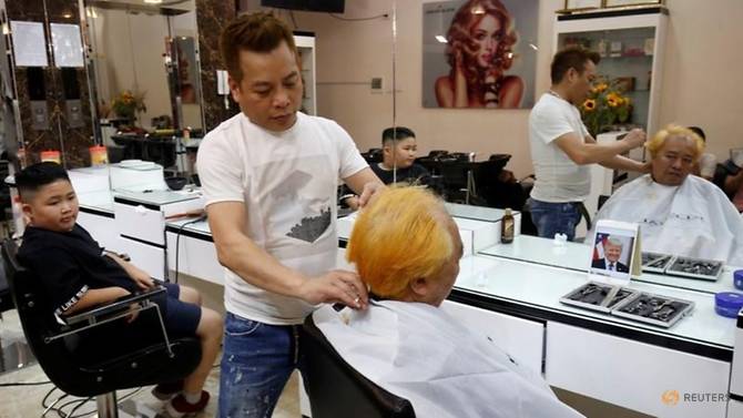 vietnamese-barber-marks-summit-with-free-trump-kim-haircuts-5.jpg