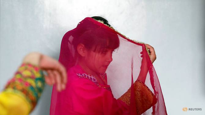 an-afghan-girl-practices-a-traditional-dance-at-an-afghan-child-education-and-care-organization-center--afceco--in-kabul-1.jpg