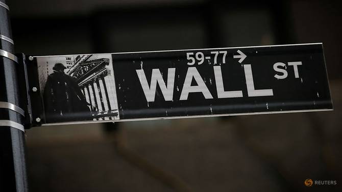 A Wall St. street sign is seen near the New York Stock Exchange (NYSE) in New York