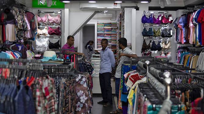 employess-wait-for-customers-inside-a-shop-owned-by-a-muslim-businessman-in-batticalao-8.jpg