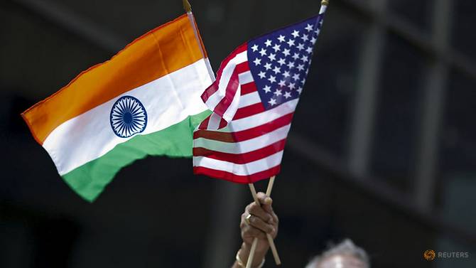 file-photo--man-holds-the-flags-while-people-take-part-in-the-35th-india-day-parade-in-new-york-1.jpg