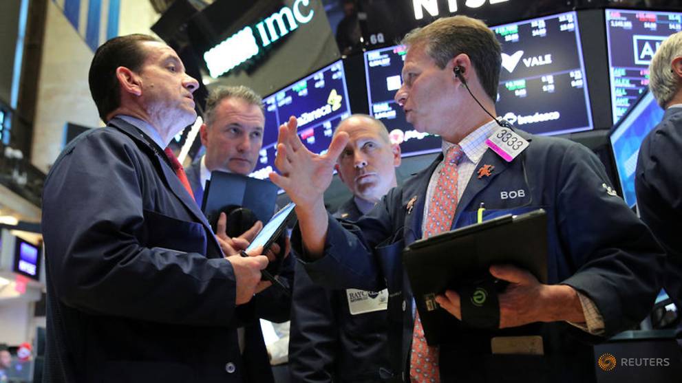 File photo  traders work on the main trading floor after opening bell at new york stock exchange  nyse  in new york 1