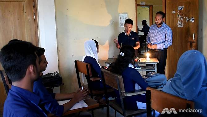 Even in dim light, the North East Ideal Polytechnic Institute teacher had his students' attention.