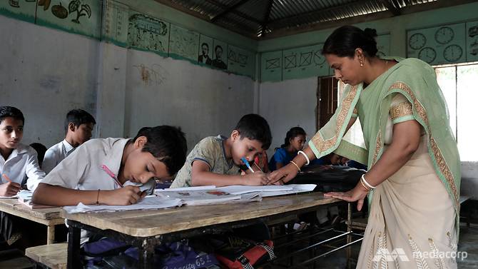 Bangladeshi migrant worker Joy Sudip Bhadro's wife, Ripa Datta, teaching in class.