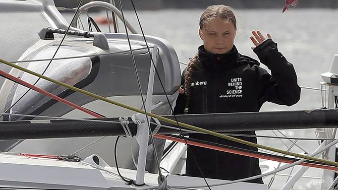 swedish-climate-activist-greta-thunberg-waves-from-aboard-the-malizia-ii-imoca-class-sailing-yacht-which-is-taking-her-to-new-york-1566142801141-2.jpg