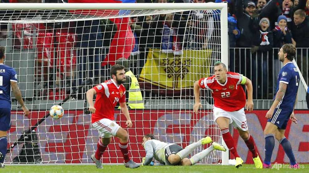 Football: Russia on brink of Euro 2020 after Dzyuba downs Scotland - CNA