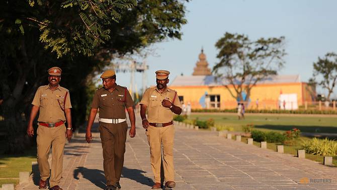 Policemen patrol inside the premises of Shore temple a day before the visit of Chinese President Xi