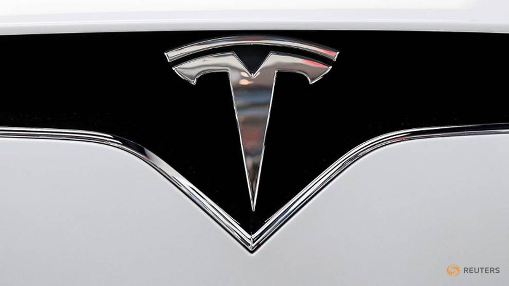 Apple, Tesla shares pop after stock splits - CNA