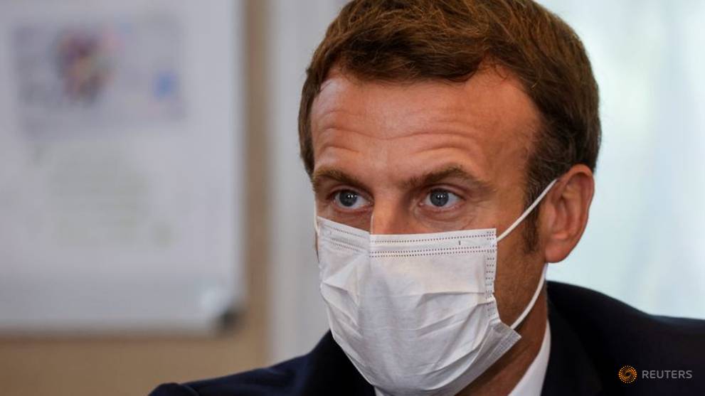 France's Macron: Expect to live with COVID-19 at least ...