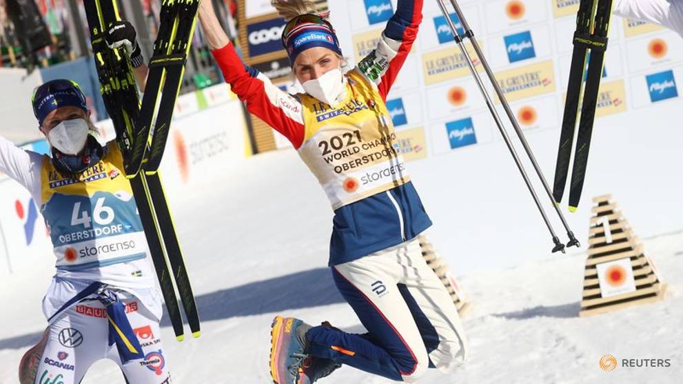 Jubilant Johaug powers to 10km freestyle gold - CNA