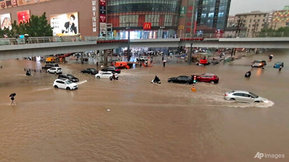 A dozen cities in China's Henan province flooded as river banks burst - CNA